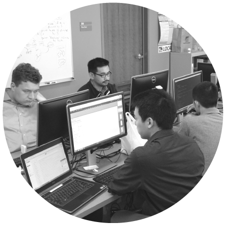 intern-circle group of IT interns working on computers