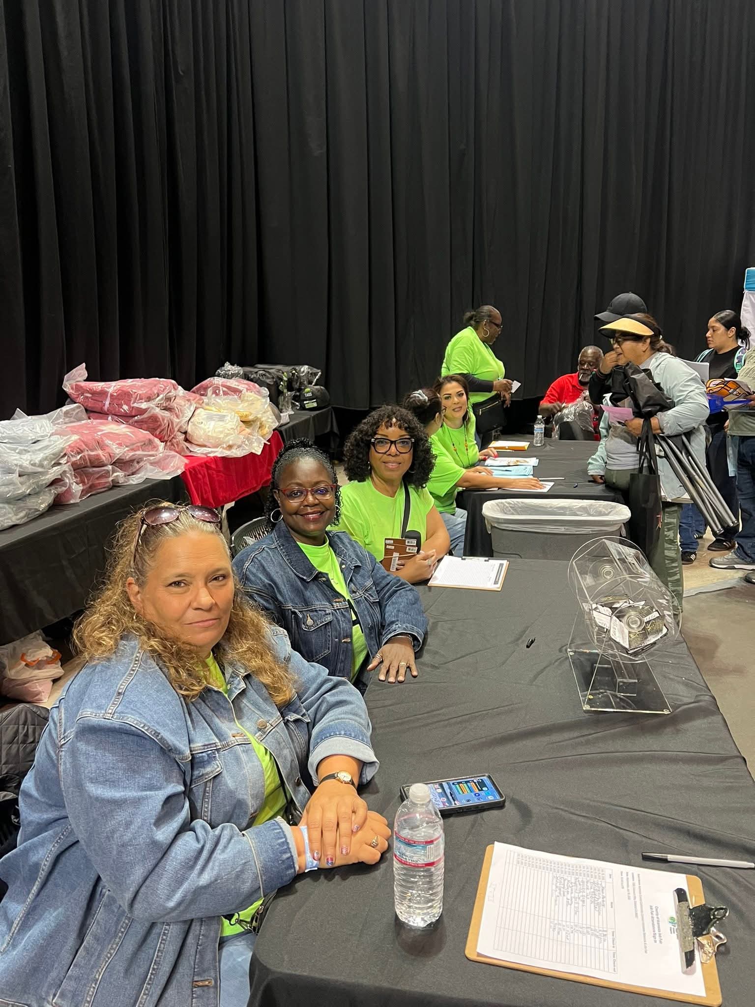 staff sitting at a job fair table