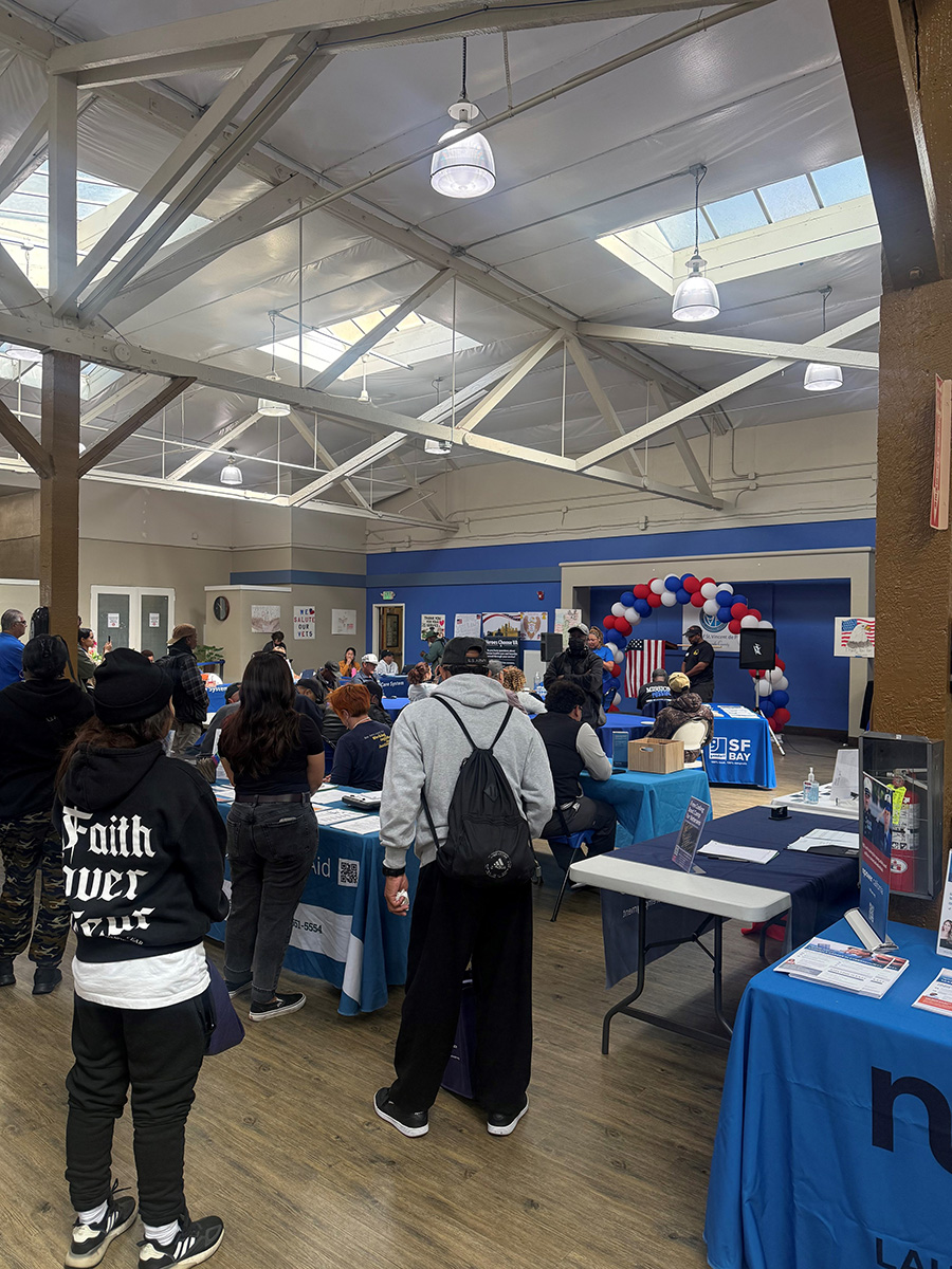 group of peopel standing around booths