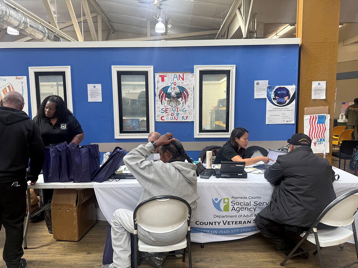 women assisting veterans at a table